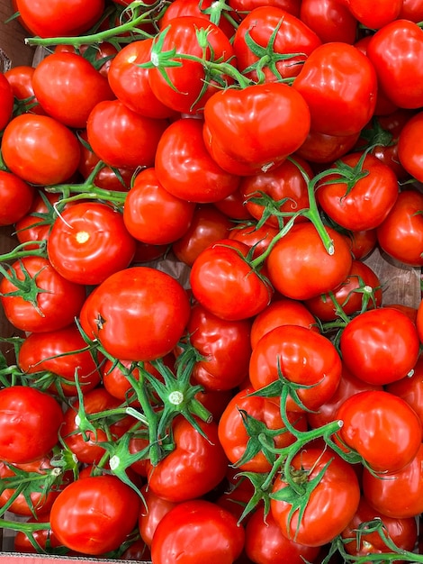 tomato green branch cherry tomatoes fruits on the counter of the market store healthy meal food