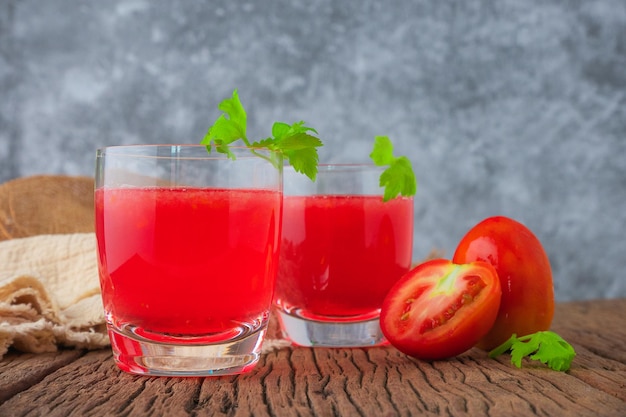 Tomato juice,Glass of tomato juice with vegetables on wooden background