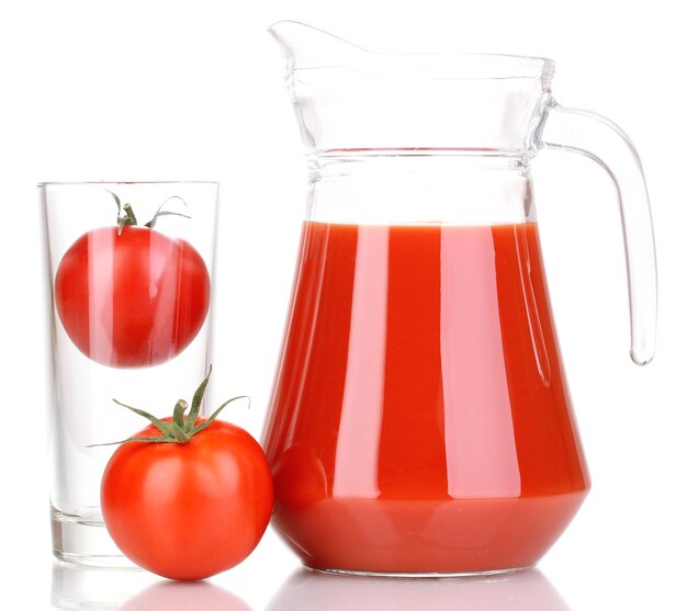 Tomato juice in pitcher isolated on white