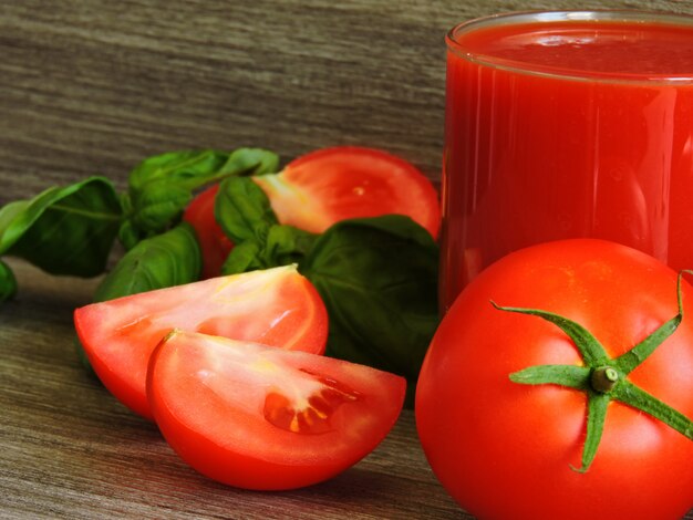 Tomato juice, tomatoes on a branch, basil, mix of peppers.  