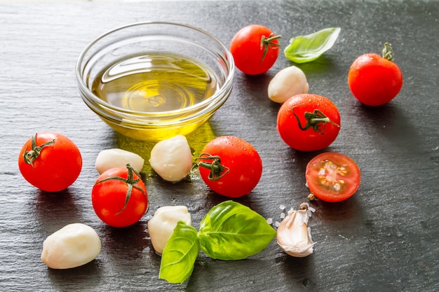 Tomato mazzarella, basil, olive oil