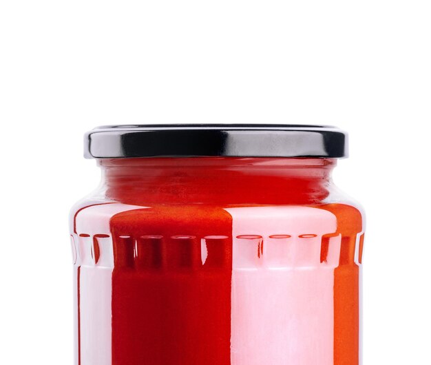 Photo tomato paste jar isolated on white