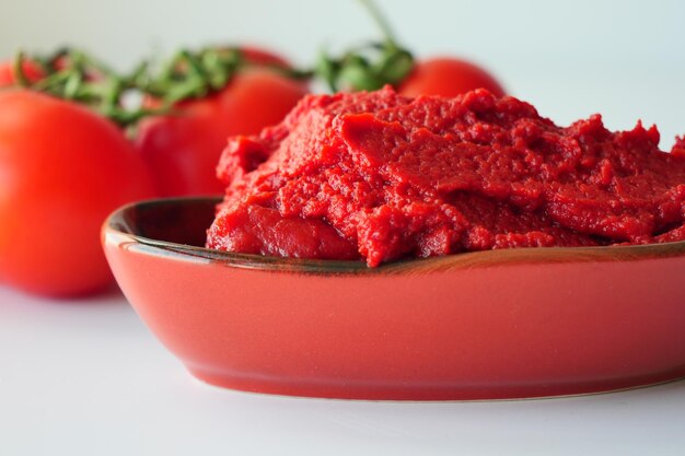 Tomato paste with ripe tomatoes