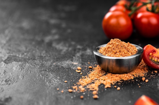 Tomato Powder close up selective focus on vintage background