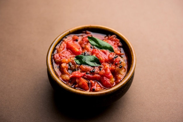 Tomato sabzi or tamatar chutney or sauce, served in a bowl. selective focus