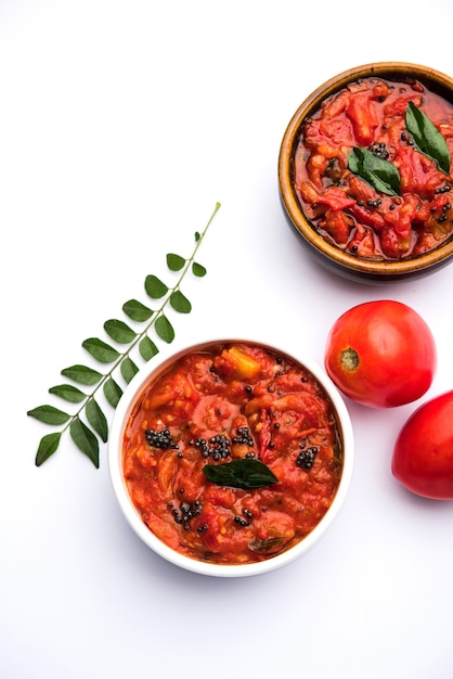 Tomato sabzi or tamatar chutney or sauce, served in a bowl. selective focus