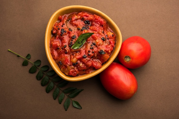 Tomato sabzi or tamatar chutney or sauce, served in a bowl. selective focus