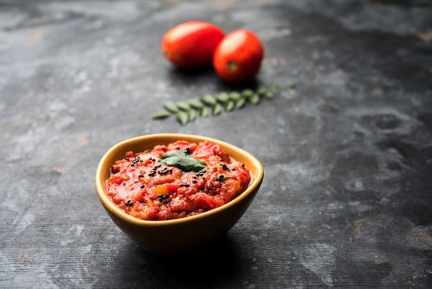 Tomato sabzi or tamatar chutney or sauce, served in a bowl. selective focus