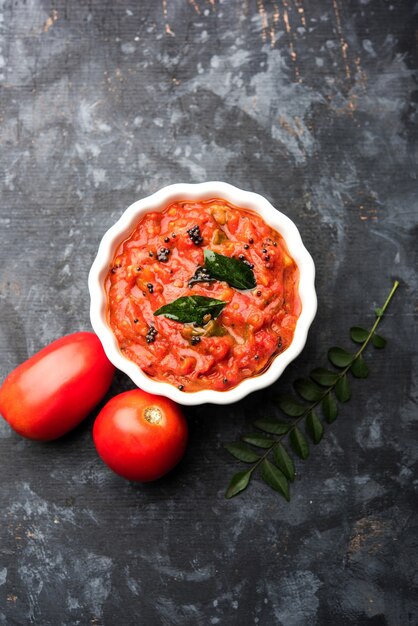 Tomato sabzi or tamatar chutney or sauce, served in a bowl. selective focus