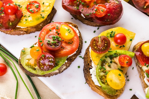 Tomato sandwich made with organic heirloom tomatoes.