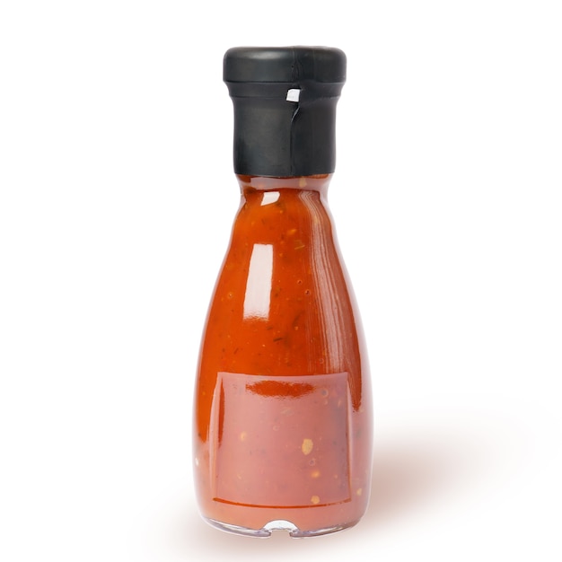 Tomato sauce in a glass bottle isolated on white