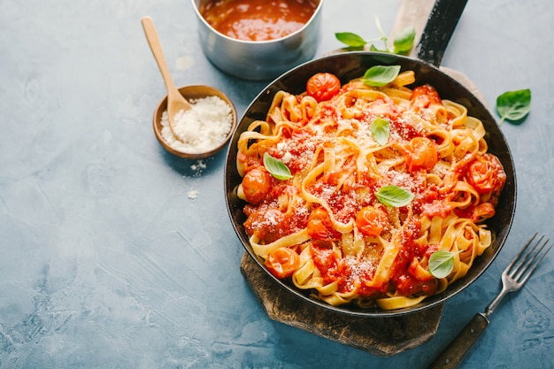 Tomato sauce spaghetti pasta on pan 