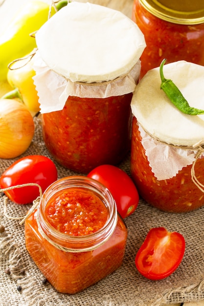 Tomato sauce with vegetables in jars