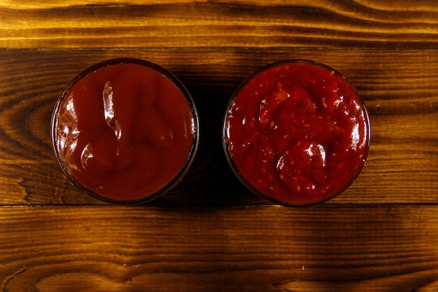 Tomato sauces on wooden table. Top view