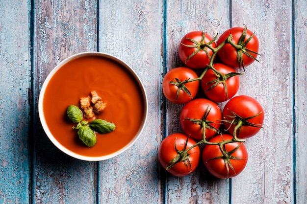 Tomato soup with basil in a bowl