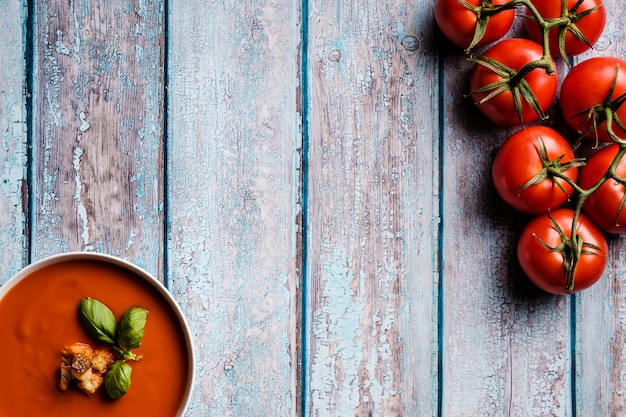 Tomato soup with basil in a bowl