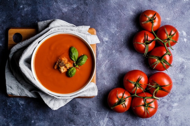 Tomato soup with basil in a bowl