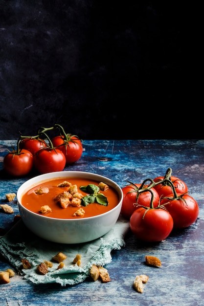 Tomato soup with basil in a bowl