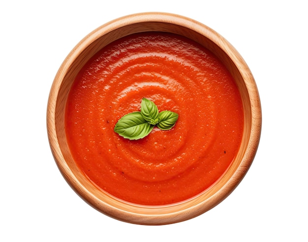 Tomato soup in wooden bowl isolated on white background top view