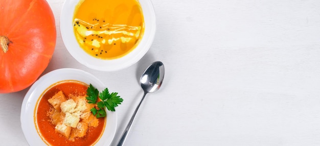 Tomato soup On a wooden surface Top view Free space for your text