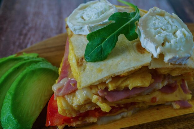 tomato tortilla and goat cheese sandwich