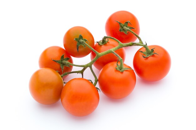 Tomato on the white isolatd surface.