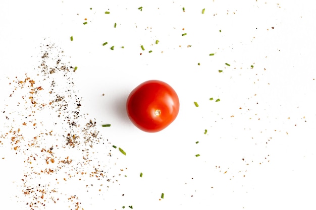 Photo tomato with pepper top view isolated