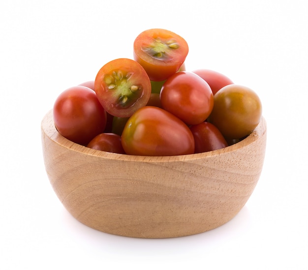 Tomato in wooden bowl