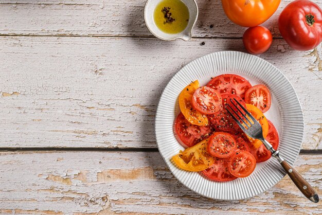 tomatoes are yellow and red on a light background