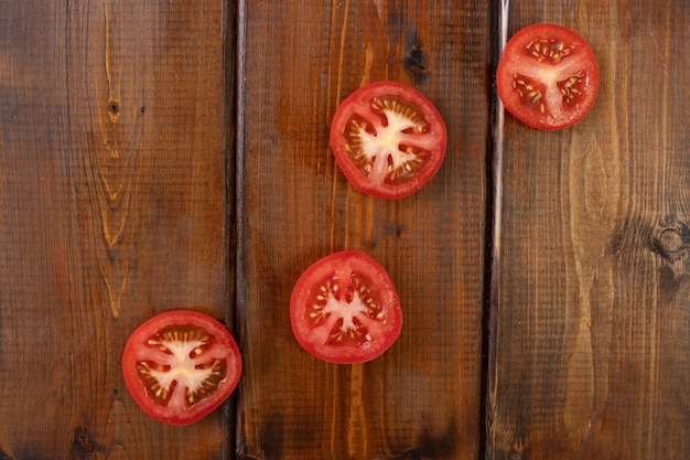 Tomatoes on a brown wooden table