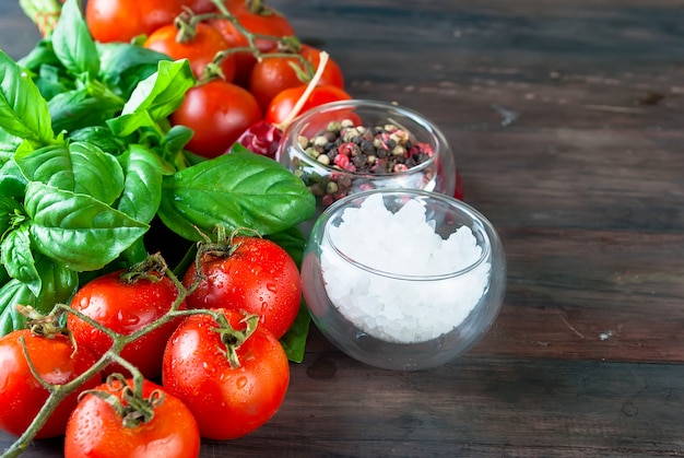 Tomatoes and bunch of fresh green basil