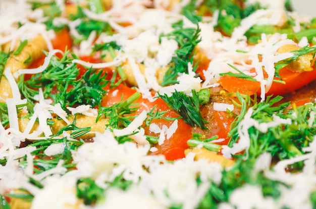 Tomatoes, cheese, parsley, mustard close-up in salad.