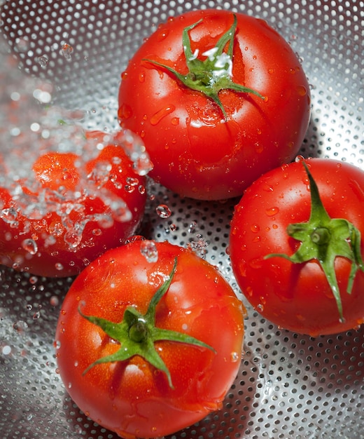 tomatoes on a colander for cleaning