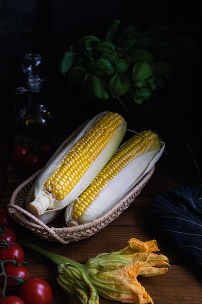 Tomatoes, corn, zucchini flowers, basil and olive oil