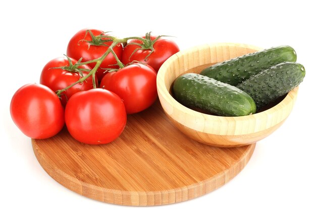 Tomatoes and cucumbers on white