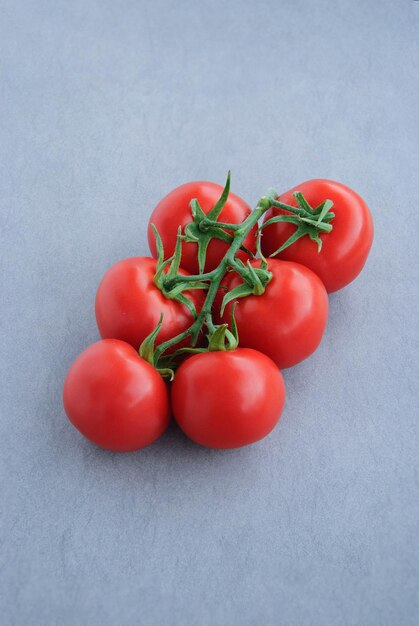 Tomatoes on dark background