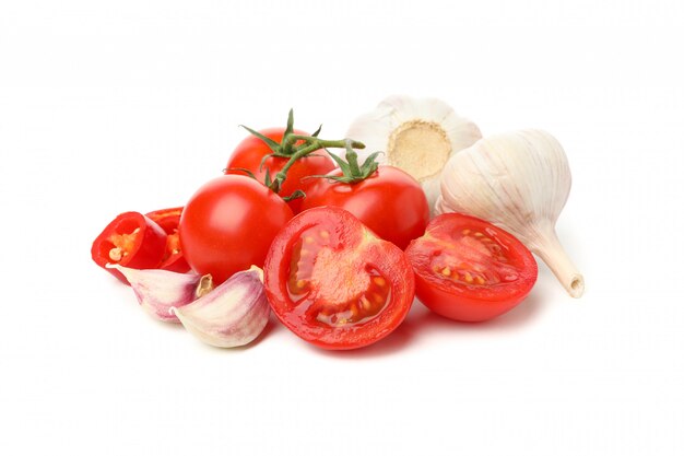 Tomatoes and garlic isolated on white background