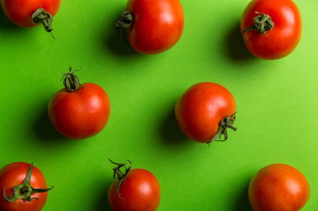 Tomatoes on Green Background