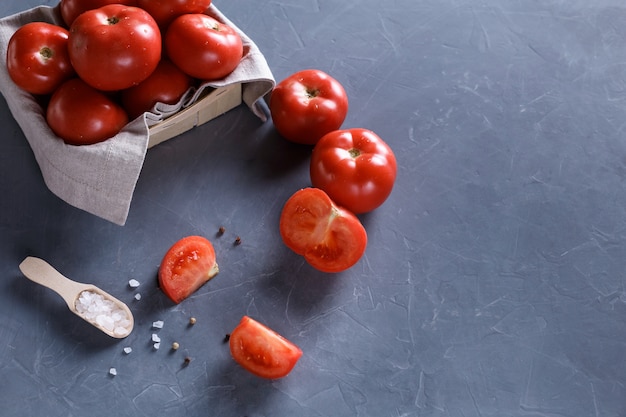 tomatoes on grey background