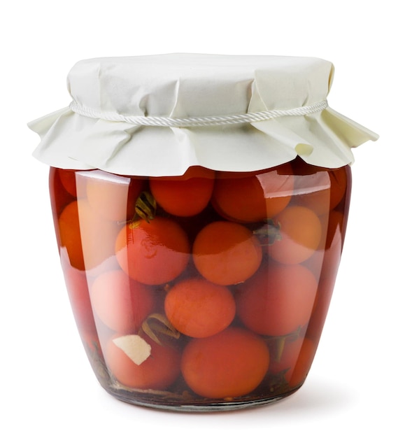 Tomatoes in a jar closeup on a white background Isolated