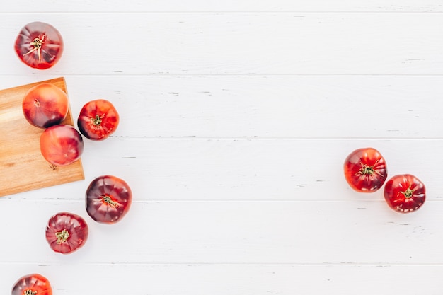 Tomatoes Mar Azul on white wooden table background