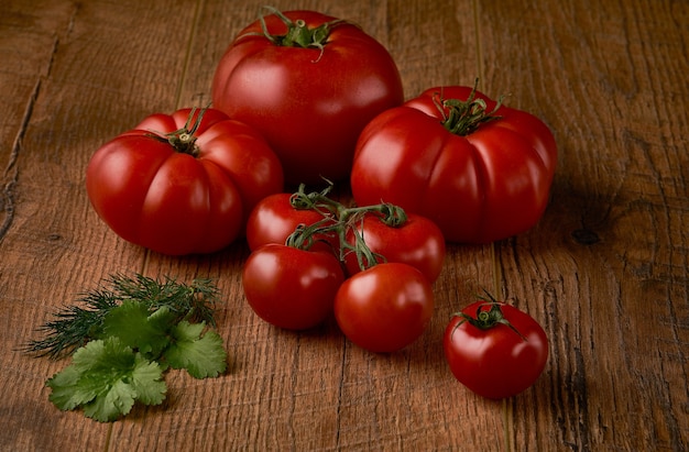 Tomatoes on rustic wooden background