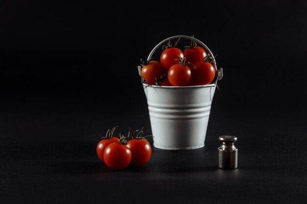 Tomatoes tomatoes in a glass tomatoes on scales wet tomatoes tomatoes on wooden background