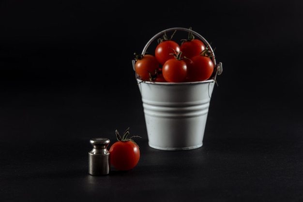 Tomatoes tomatoes in a glass tomatoes on scales wet tomatoes tomatoes on wooden background