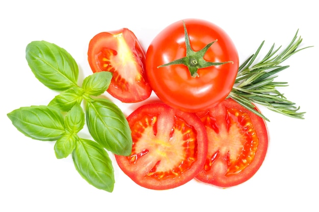 Tomatoes tomatos vegetables with basil from above isolated on white