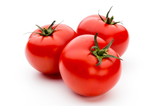 Tomatoes on a white surface