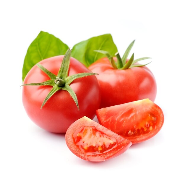 Tomatoes with basil leaves isolated