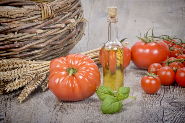 Tomatoes with olive oil bottle