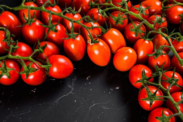 Tomatoes on wood background. Close-up of fresh. Group of tomatoes. Space for text top view