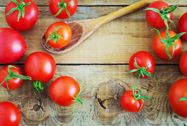 Tomatoes on wooden background